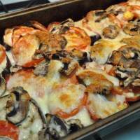 Баклажаны в духовке с помидорами, сыром и грибами